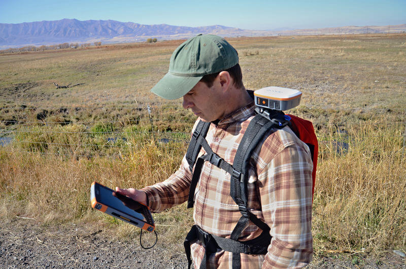 Land management professional using the hands-free Geode sub-meter GPS receiver to collect data. 