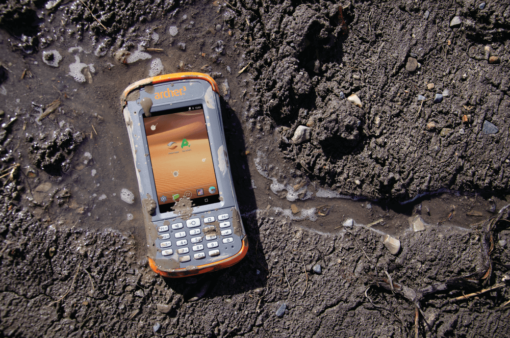 Archer 3 Rugged Handheld in mud and water.